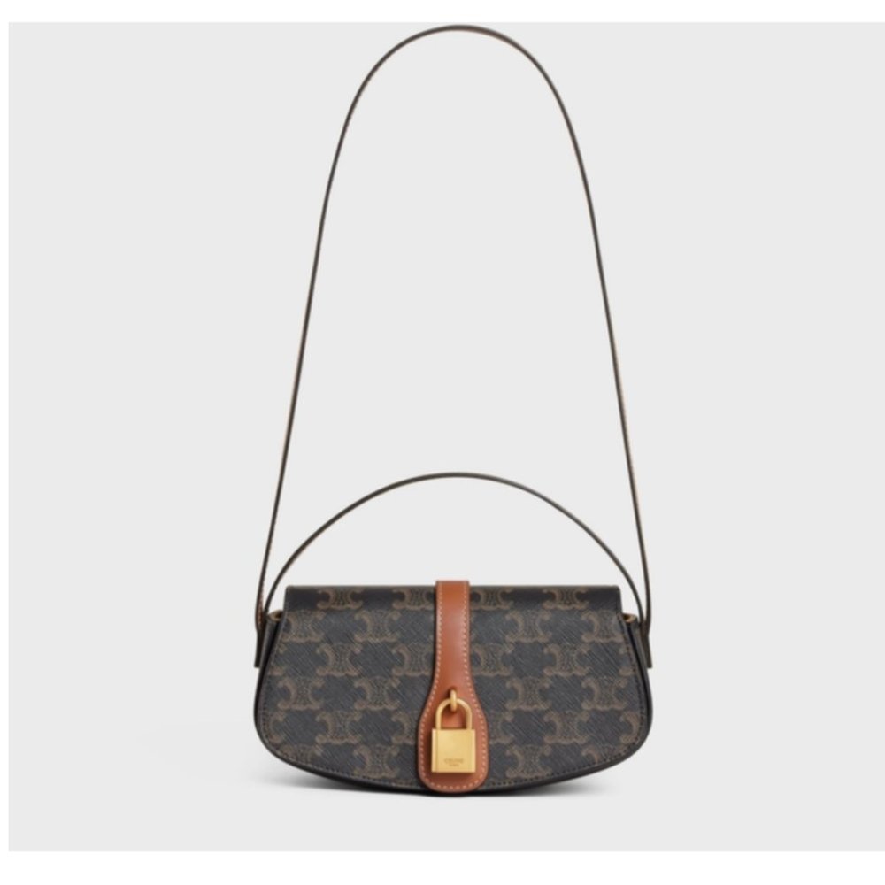 CELINE Tabou Clutch on strap in Triomphe canvas and Calfskin Tan